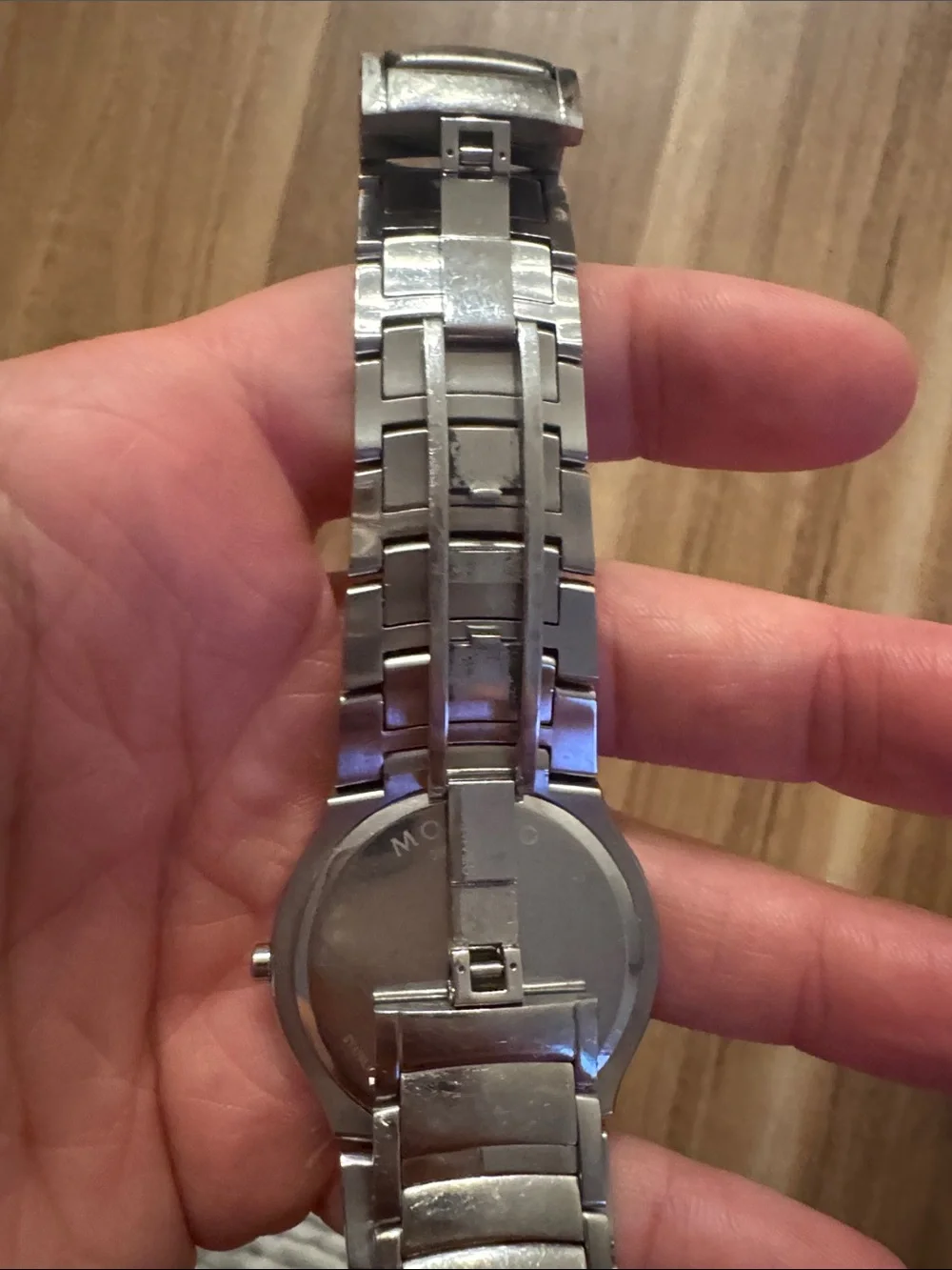 Movado Silver Bracelet Watch with Black Dial